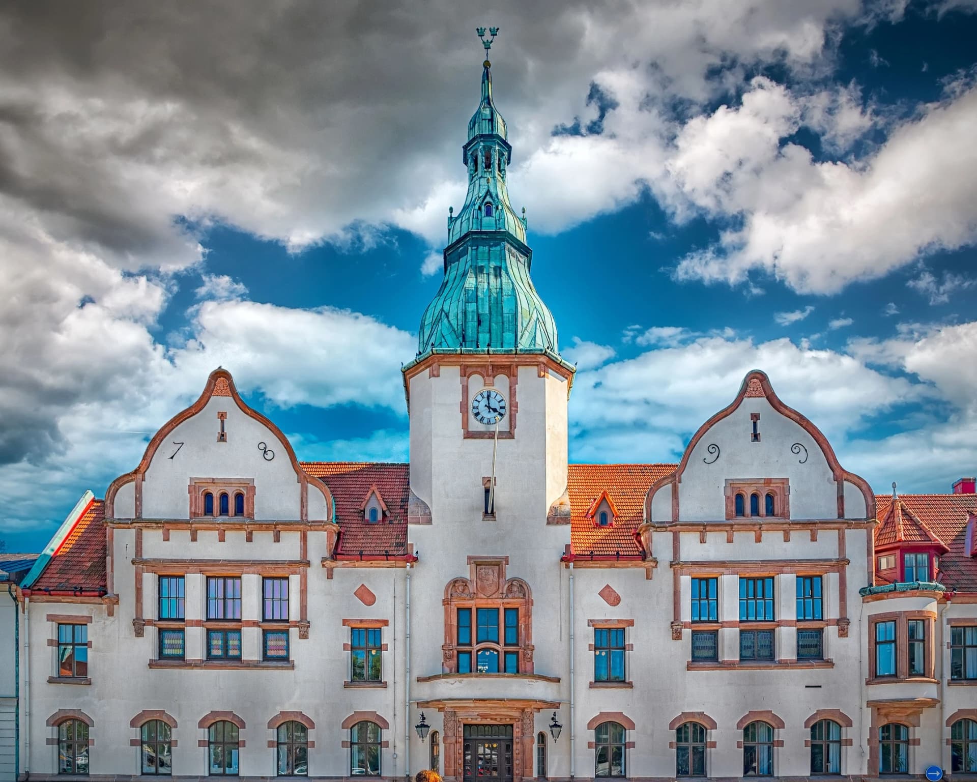 Old vintage town hall under a blue cloudy sky
