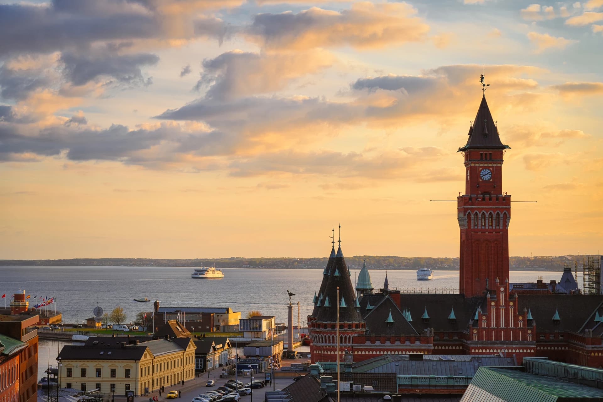The Town hall is the main landmark of Helsingborg, Sweden. The historical Town Hall was built in neo-Gothic style in 1897. Helsingor, Denmark in the background.