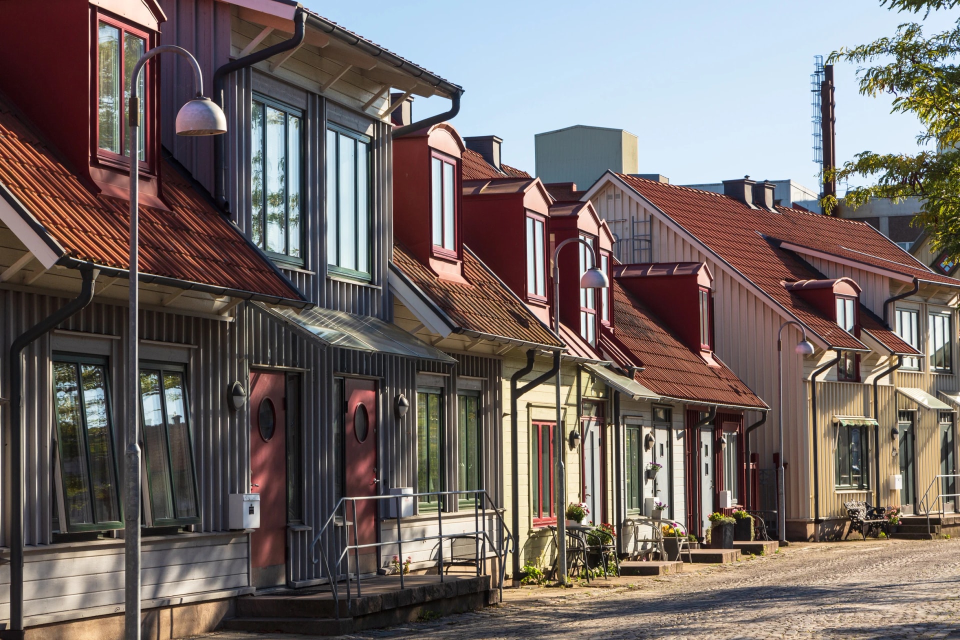Idyllic cobblestone street with colorful wooden houses in the old town of Falkenberg in Sweden in autumn
