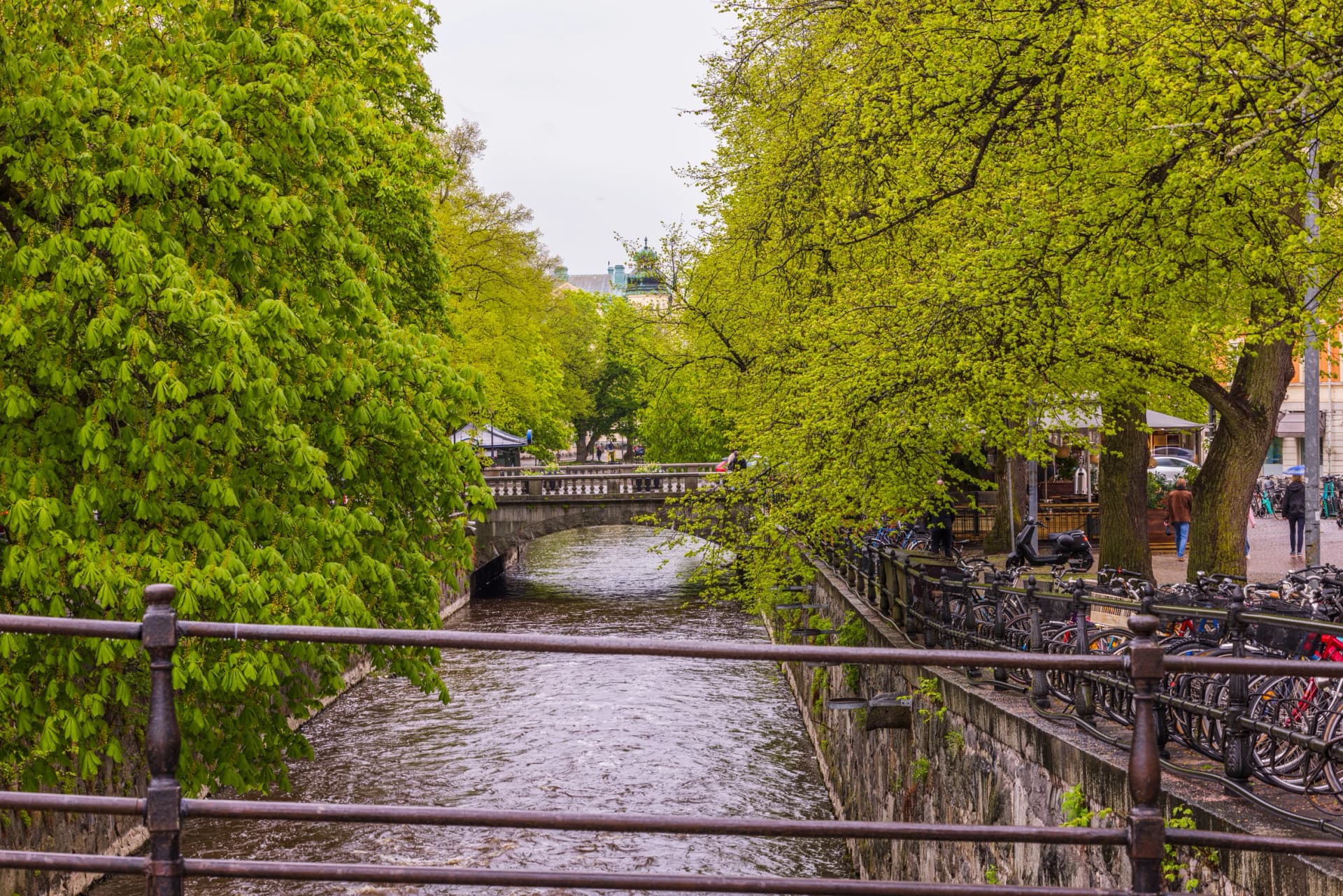 Beautiful view of bridge over river in center of Uppsala on summer day. Sweden. Uppsala.
