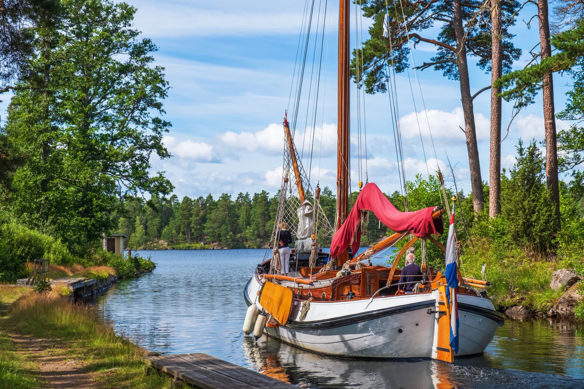 Old beautiful sailboat on an idyllic Göta canal on a sunny summer day