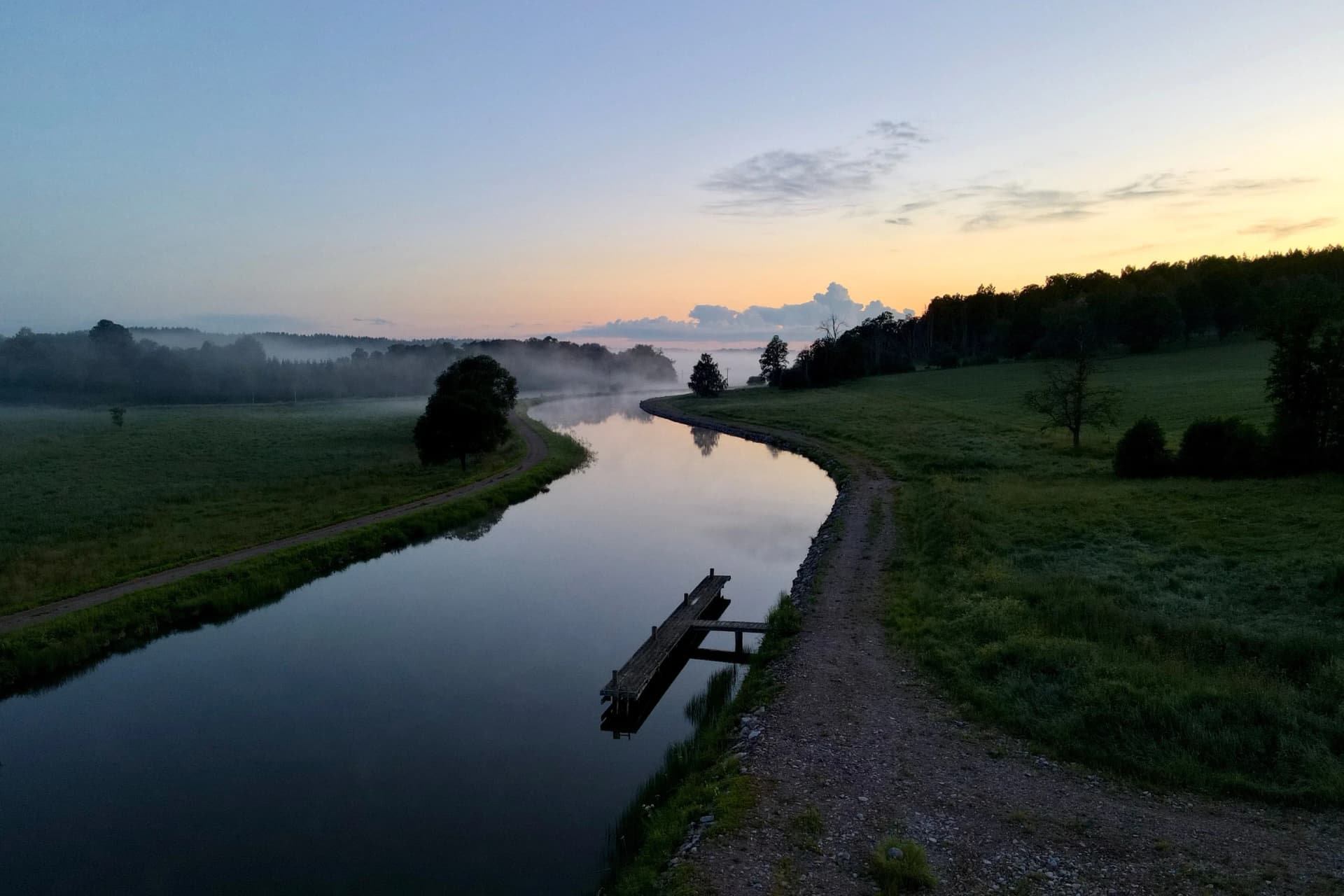 Gøta canal in southern Sweden winding through a fog covered landscape