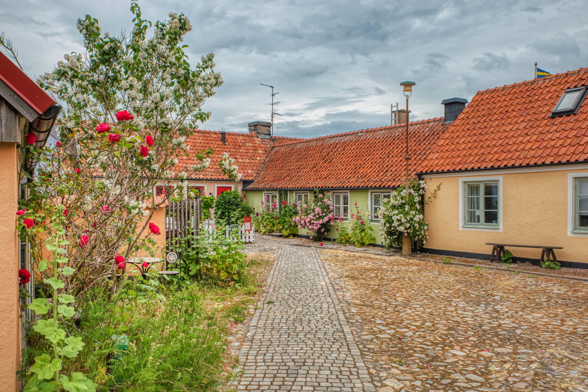 Cobbled town square in a small, touristic fishermen village in the Osterlen region shows a cosy neighbourhood and traveller location. The cozy town conveys a sense of community. Simrishamn, Sweden