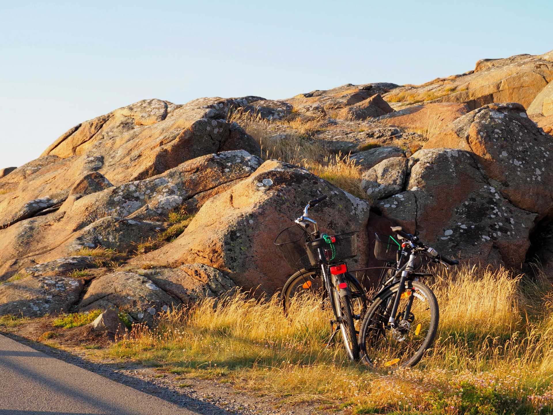 Bicycles near to the rock in the beach in Sweden during summer in varberg